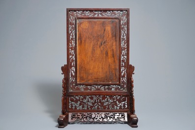 A Chinese carved wood table screen with a porcelain winter landscape plaque after He Xuren, 20th C.