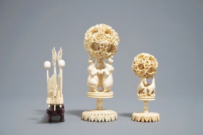 A Chinese carved ivory model of a junk and two Canton puzzle balls, 19/20th C.