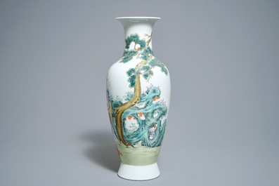 A Chinese famille rose vase with figures in a garden, Hongxian mark, 20th C.