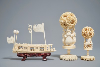 A Chinese carved ivory model of a junk and two Canton puzzle balls, 19/20th C.