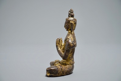 A Nepalese parcel-gilt bronze Buddha Namaskara, 16/17th C.