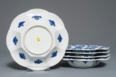 Five Chinese blue and white lobed plates with floral design, Kangxi