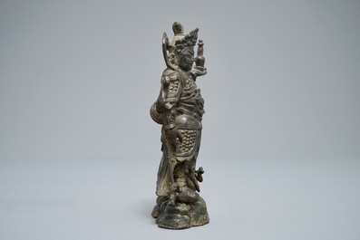 A Chinese bronze figure of the guardian king Dhanada, Ming