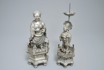 A Chinese pewter candlestick and a figure of a boy, 19/20th C.