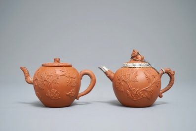 Two Chinese Yixing stoneware teapots with applied floral design, Kangxi