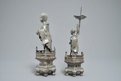 A Chinese pewter candlestick and a figure of a boy, 19/20th C.