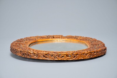 A finely carved Chinese wooden mirror frame, Canton, 19/20th C.