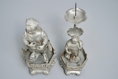 A Chinese pewter candlestick and a figure of a boy, 19/20th C.