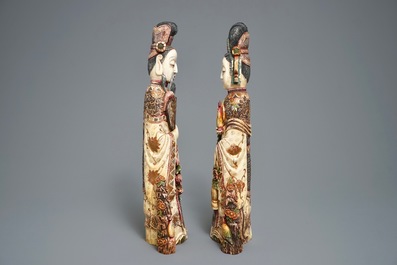 Two Chinese polychrome carved ivory figures, 19th C.