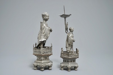 A Chinese pewter candlestick and a figure of a boy, 19/20th C.