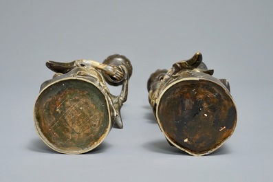 A pair of Chinese bronze 'Hehe Er Xian brothers' candlesticks, 19/20th C.