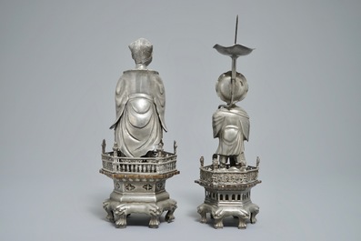 A Chinese pewter candlestick and a figure of a boy, 19/20th C.