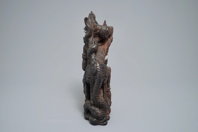 An Indonesian calamandar wooden sculpture of Vishnu riding Naga, 19th C.