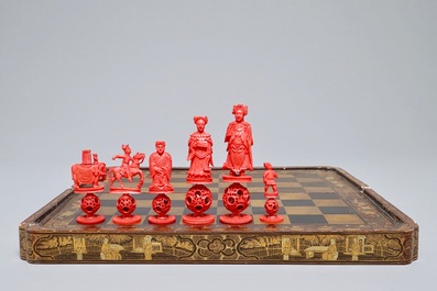 A Chinese lacquered chess and backgammon board with ivory chessmen, 19th C.