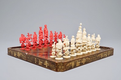 A Chinese lacquered chess and backgammon board with ivory chessmen, 19th C.