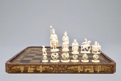 A Chinese lacquered chess and backgammon board with ivory chessmen, 19th C.