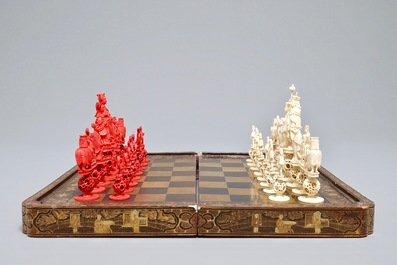 A Chinese lacquered chess and backgammon board with ivory chessmen, 19th C.