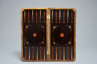 A Chinese lacquered chess and backgammon board with ivory chessmen, 19th C.