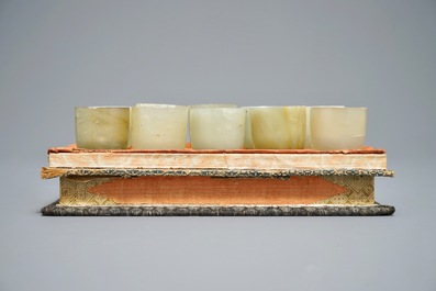 A set of ten Chinese celadon jade cups, 19/20th C.