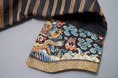 A Chinese imperial brown-ground kesi eight-dragon robe, probably Jiaqing, 1st half 19th C.