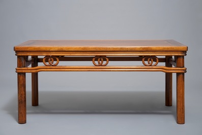 A Chinese wooden rectangular low table, 19th C.