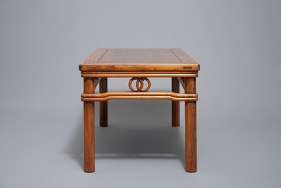 A Chinese wooden rectangular low table, 19th C.