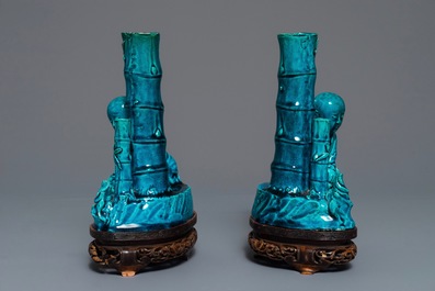 A pair of Chinese turquoise glazed incense holders on wooden stand, 19th C.