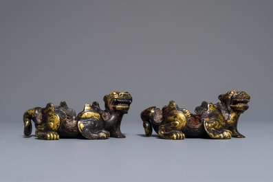 A pair of Chinese gilt bronze mythical beasts with traces of seal wax, Han or later