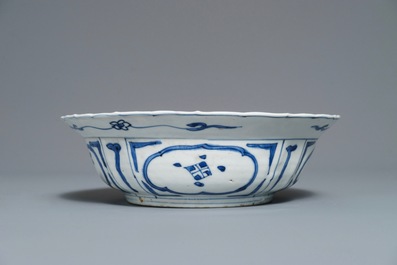 A Chinese blue and white kraak porcelain klapmuts bowl with a flower basket, Wanli