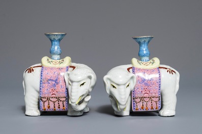 A pair of Chinese famille rose elephant-form candlesticks, 19th C.