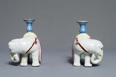 A pair of Chinese famille rose elephant-form candlesticks, 19th C.