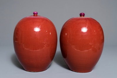 A pair of Chinese egg-shaped monochrome oxblood-glazed jars and covers, 19th C.