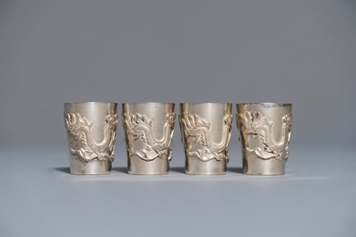 A Chinese silver liquor set on tray with applied dragon design, 19/20th C.