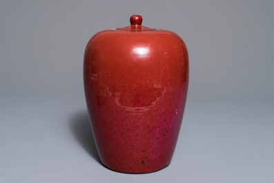 A Chinese monochrome oxblood-glazed jar and cover, 19th C.