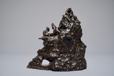 A Chinese bronze incense burner modelled as a mountain with qi-players, 18/19th C.