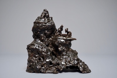 A Chinese bronze incense burner modelled as a mountain with qi-players, 18/19th C.