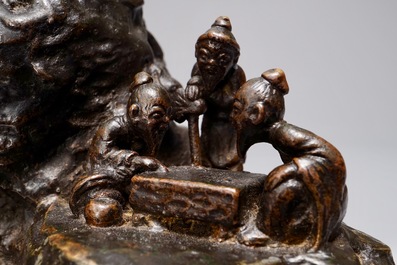 A Chinese bronze incense burner modelled as a mountain with qi-players, 18/19th C.