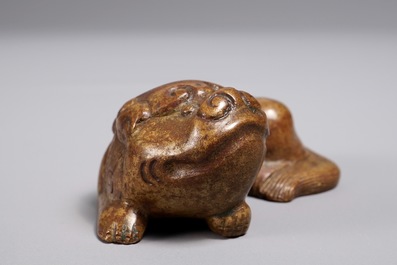 A Chinese bronze scroll or paper weight shaped as a Buddhist lion or Shishi, 18/19th C.