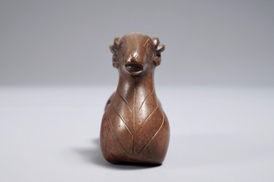 A Chinese bronze scroll or paper weight shaped as a ram, 17/18th C.