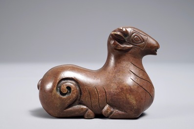 A Chinese bronze scroll or paper weight shaped as a ram, 17/18th C.