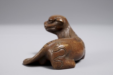 A Chinese bronze scroll or paper weight shaped as a qilin, 18/19th C.
