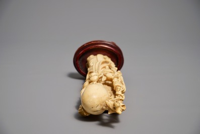 Two Chinese carved ivory figures of Shou Lao and Lu Dongbin, 19th C.