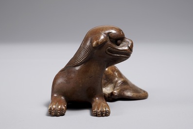 A Chinese bronze scroll or paper weight shaped as a qilin, 18/19th C.