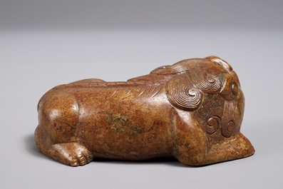 A Chinese bronze scroll or paper weight shaped as a Buddhist lion or Shishi, 18/19th C.