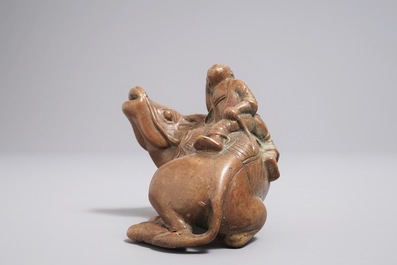 A Chinese bronze water dropper shaped as a boy on a buffalo, 18/19th C.