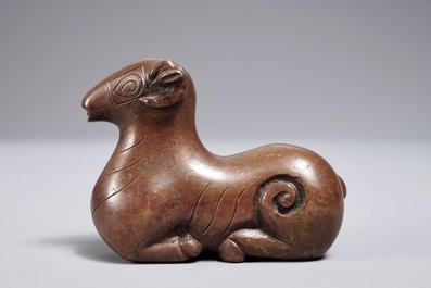 A Chinese bronze scroll or paper weight shaped as a ram, 17/18th C.