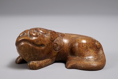 A Chinese bronze scroll or paper weight shaped as a Buddhist lion or Shishi, 18/19th C.