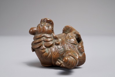 A Chinese bronze scroll or paper weight shaped as a mythical beast with rider, 19/20th C.