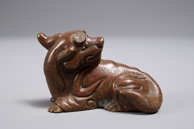 A Chinese bronze scroll or paper weight shaped as a chilong, 18/19th C.