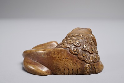 A Chinese bronze scroll or paper weight shaped as a Buddhist lion or Shishi, 17/18th C.